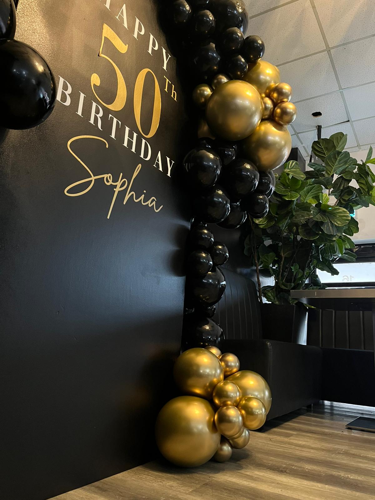 Black & gold 50th birthday balloons